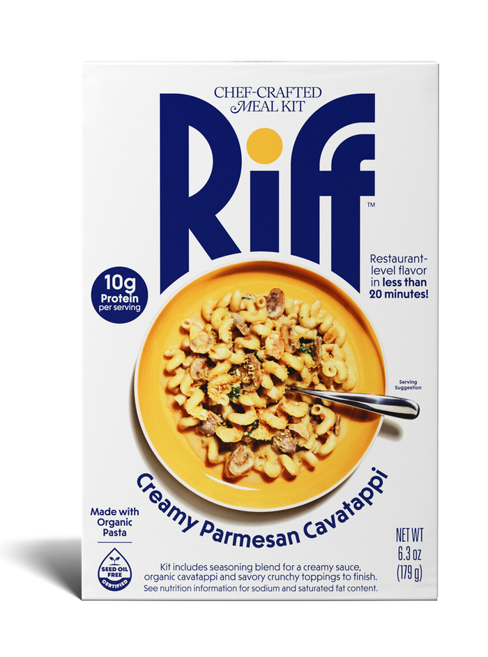 A box of Riff Creamy Parmesan Cavatappi chef-crafted meal kit, featuring a white box with navy branding and a photo of the prepared pasta dish with mushrooms on a yellow plate on the front.
