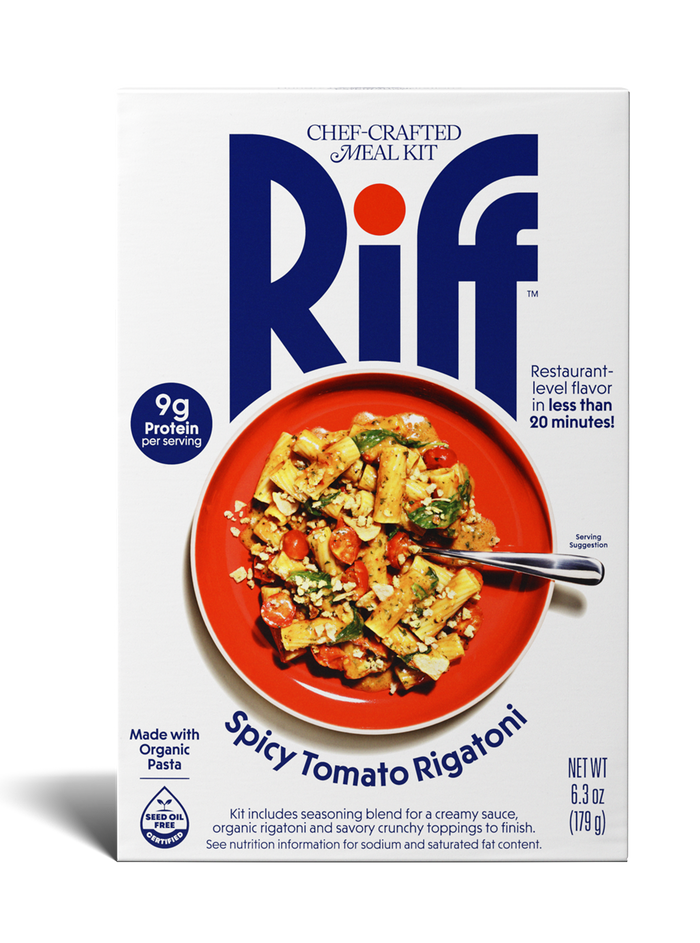 A box of Riff Spicy Tomato Rigatoni chef-crafted meal kit, featuring a white box with navy branding and a photo of the prepared pasta dish with tomatoes on a red plate on the front.