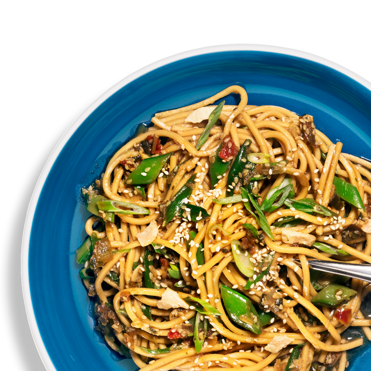 Close-up overhead shot of Riff sesame ginger noodles topped with sesame seeds, snap peas, and scallions in a blue bowl, with a fork resting on the side.