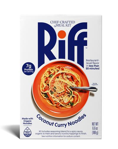 Front of a Riff Coconut Curry Noodles chef-crafted meal kit box, showing an orange bowl of coconut curry noodles with a spoon.