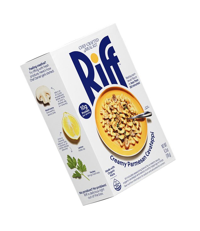 A Riff Creamy Parmesan Cavatappi chef-crafted meal kit box shown at an angle, revealing both the front plated-dish photo and the side panel with fresh mushroom, lemon, and parsley riffing suggestions.