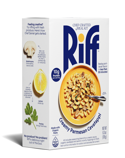 Angled view of a Riff Creamy Parmesan Cavatappi chef-crafted meal kit box, featuring a yellow bowl of creamy cavatappi pasta with mushrooms and herbs and a spoon resting in the dish.
