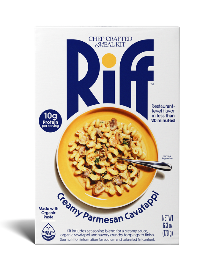 Front of a Riff Creamy Parmesan Cavatappi chef-crafted meal kit box shown straight-on, featuring a yellow bowl of creamy cavatappi pasta with mushrooms and herbs and a spoon resting in the dish.