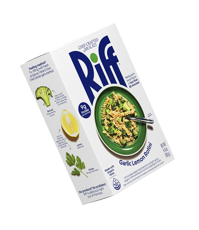 A Riff Garlic Lemon Rotini chef-crafted meal kit box shown at an angle, revealing both the front plated-dish photo and the side panel with fresh broccoli, lemon, and parsley riffing suggestions.