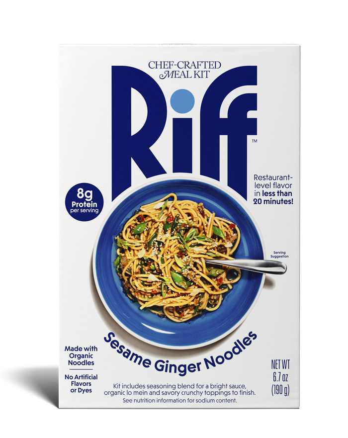 Front of a Riff Sesame Ginger Noodles chef-crafted meal kit box shown straight-on, featuring a blue bowl of noodles topped with sesame seeds and vegetables and a spoon resting in the dish.