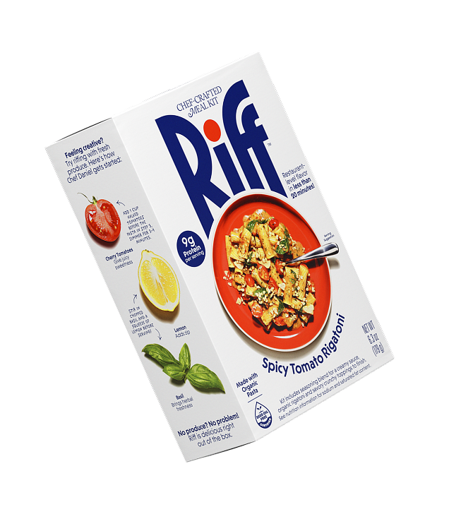 A Riff Spicy Tomato Rigatoni chef-crafted meal kit box shown at an angle, revealing both the front plated-dish photo and the side panel with fresh cherry tomato, lemon, and basil riffing suggestions.