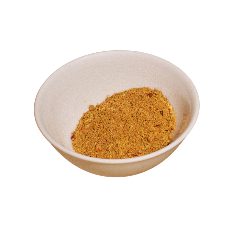 A small off-white ceramic bowl filled with a mound of Riff seasoning blend